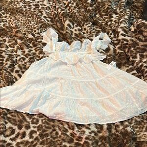 Charming White Top with Ruffle Details